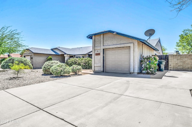 3201 W Mohawk Ln, Phoenix, AZ 85027 - view of front facade with concrete driveway and a garage