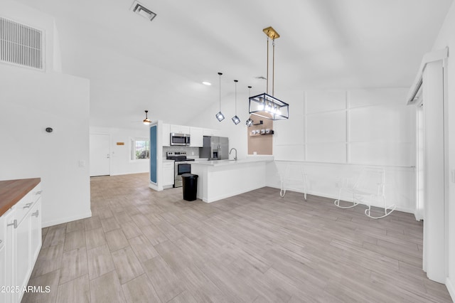 3201 W Mohawk Ln, Phoenix, AZ 85027 - unfurnished living room with a sink, lofted ceiling, and light wood-style flooring