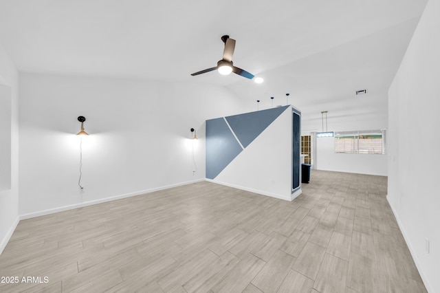 3201 W Mohawk Ln, Phoenix, AZ 85027 - spare room with ceiling fan, light wood-style flooring, baseboards, and lofted ceiling