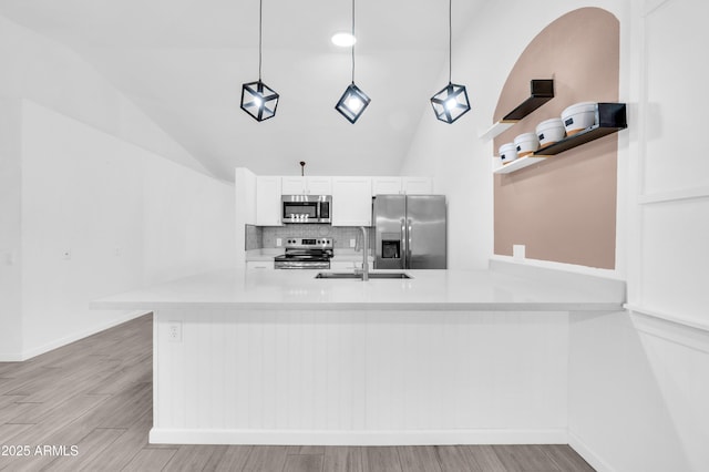 3201 W Mohawk Ln, Phoenix, AZ 85027 - kitchen with appliances with stainless steel finishes, a sink, lofted ceiling, open shelves, and light countertops