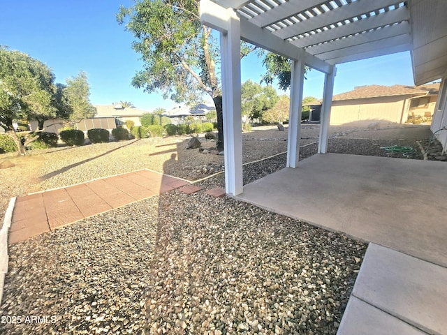 view of patio / terrace with fence and a pergola