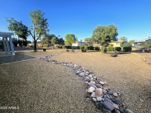 view of yard featuring fence