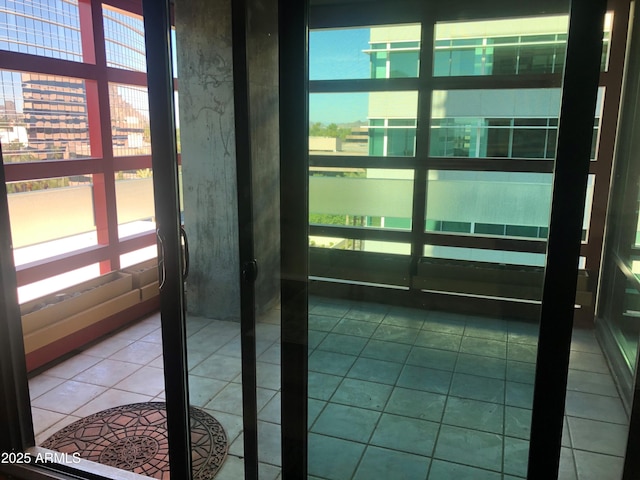 entryway featuring tile patterned flooring and a healthy amount of sunlight