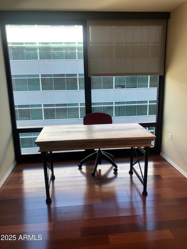 dining area featuring dark hardwood / wood-style flooring and plenty of natural light