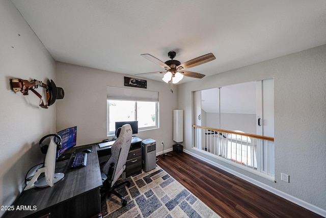 7110 N 28th Dr, Phoenix, AZ 85051 - office space with dark wood finished floors, a ceiling fan, and baseboards