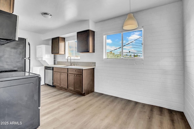 31 W 2nd St, Mesa, AZ 85201 - kitchen with appliances with stainless steel finishes, light wood-type flooring, light countertops, and pendant lighting