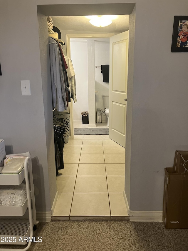 bathroom featuring tile patterned floors and toilet