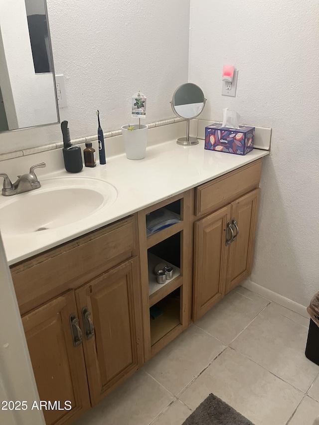 bathroom with tile patterned flooring and vanity