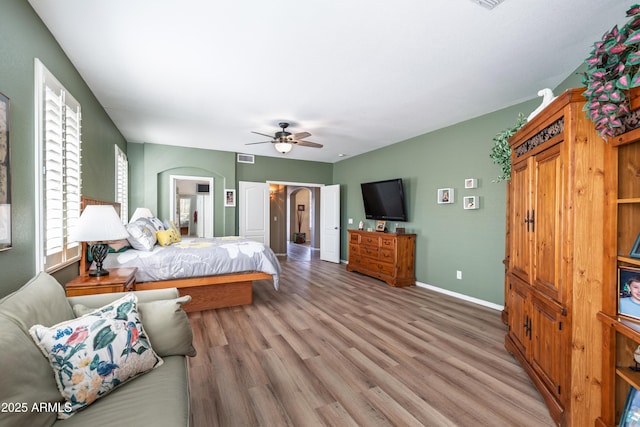 bedroom with ceiling fan and light wood-type flooring