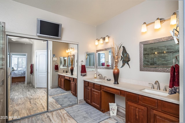 bathroom with vanity, hardwood / wood-style floors, and walk in shower