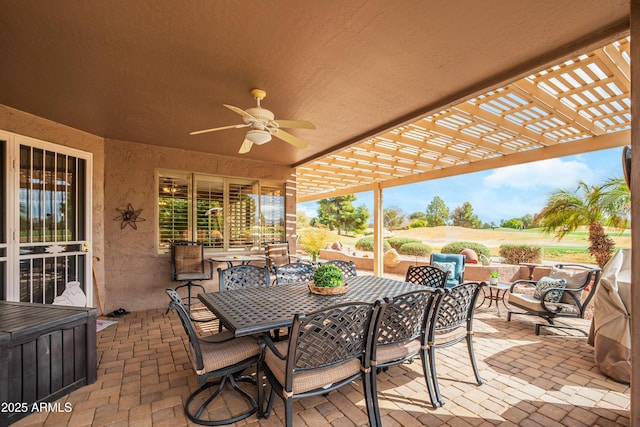 view of patio / terrace with ceiling fan and a pergola