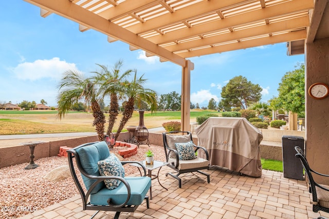 view of patio featuring area for grilling and a pergola