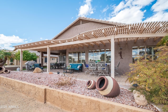 view of patio / terrace featuring a pergola and outdoor lounge area