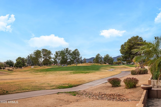 view of property's community featuring a mountain view and a lawn