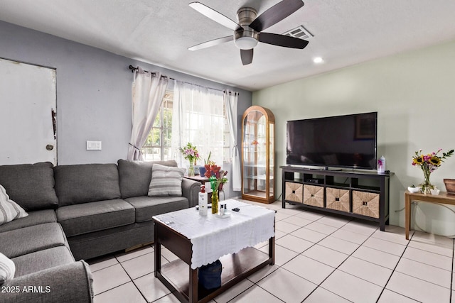 3525 W Latham St, Phoenix, AZ 85009 - living room featuring ceiling fan, light tile patterned flooring, arched walkways, and recessed lighting