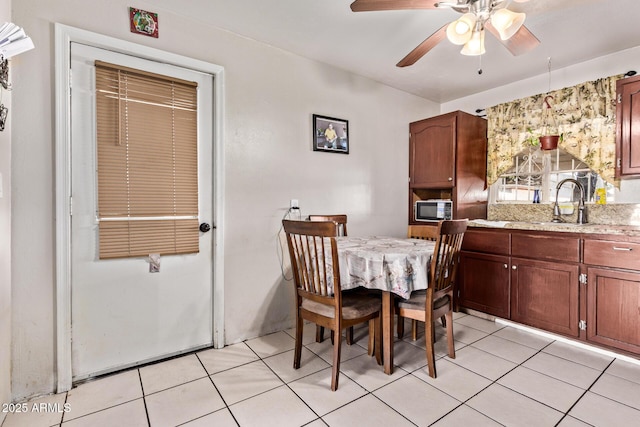 3525 W Latham St, Phoenix, AZ 85009 - dining space featuring ceiling fan and light tile patterned flooring