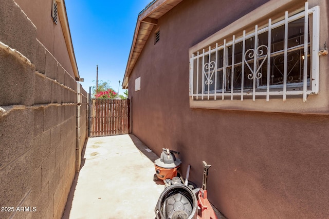3525 W Latham St, Phoenix, AZ 85009 - view of home's exterior with stucco siding and fence