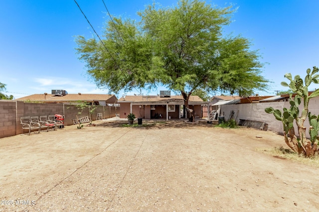 3525 W Latham St, Phoenix, AZ 85009 - back of house with a fenced backyard and a patio area