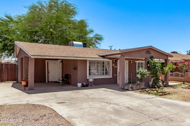 3525 W Latham St, Phoenix, AZ 85009 - ranch-style house with stucco siding, fence, roof with shingles, and concrete driveway