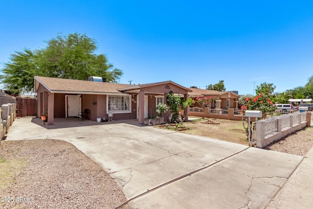 3525 W Latham St, Phoenix, AZ 85009 - single story home featuring stucco siding, a fenced front yard, driveway, and a gate