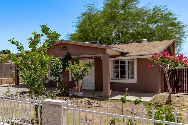 3525 W Latham St, Phoenix, AZ 85009 - view of front of home with stucco siding and a fenced front yard