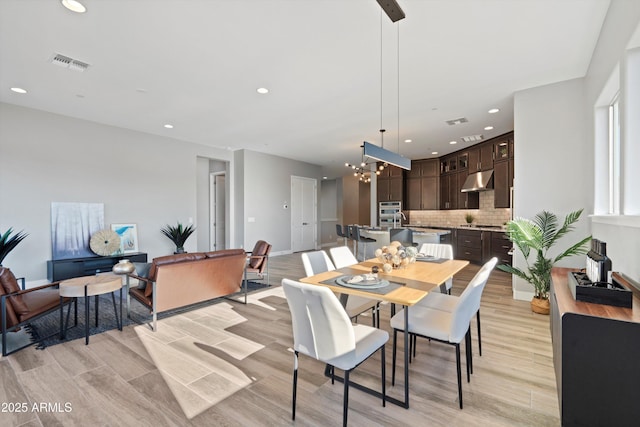 dining area featuring an inviting chandelier