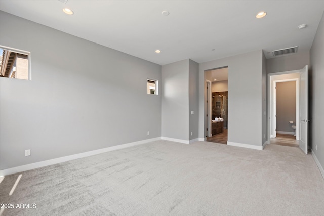 spare room with light colored carpet