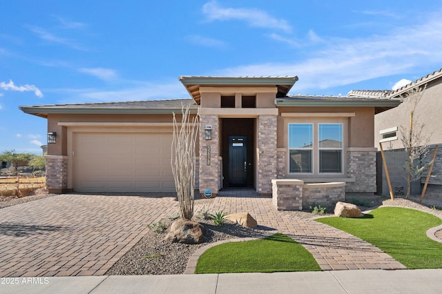 prairie-style home featuring a garage