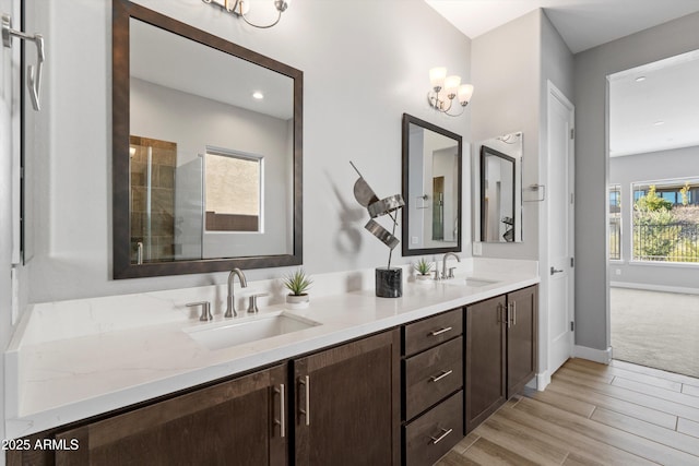 bathroom with vanity and wood-type flooring