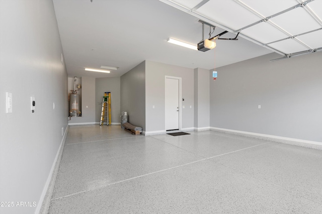 garage featuring gas water heater and a garage door opener