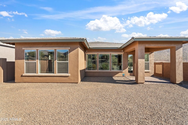 rear view of house with a patio area