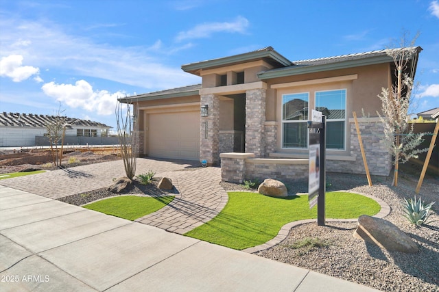 prairie-style house featuring a garage