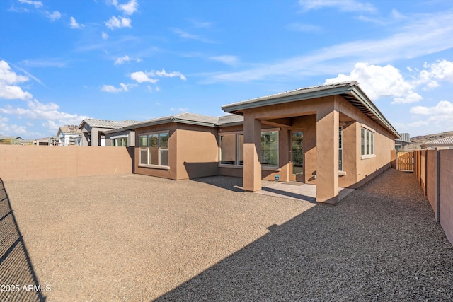 rear view of property with a patio