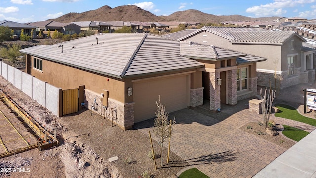 view of front facade with a mountain view and a patio area