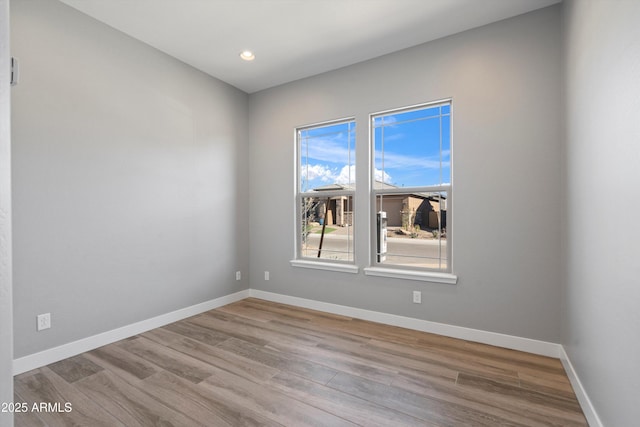 spare room with light hardwood / wood-style floors