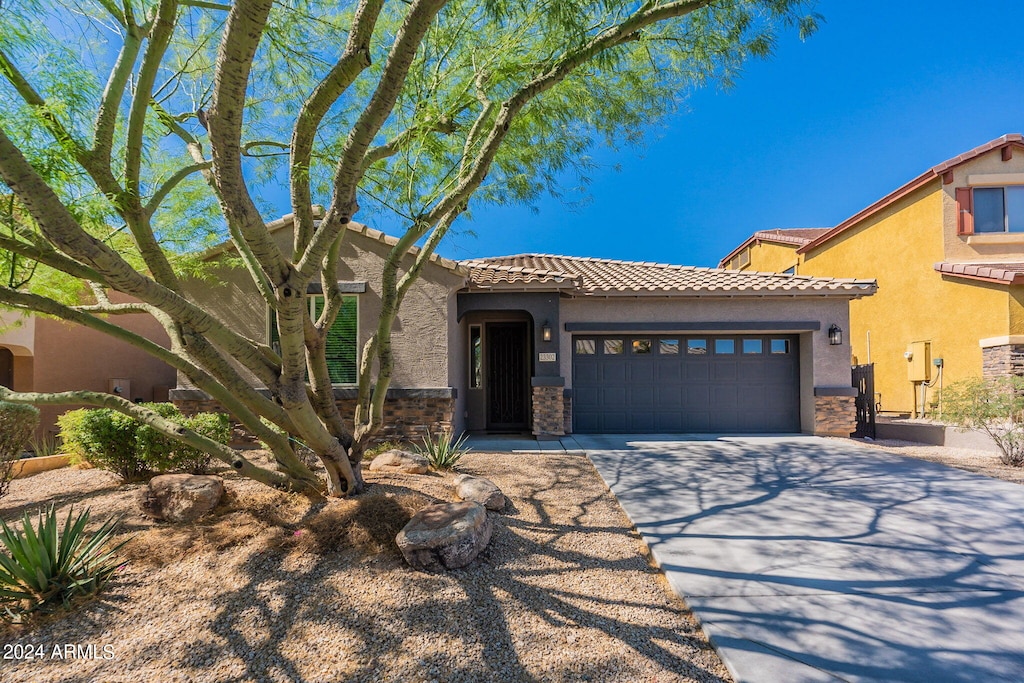 view of front of property with a garage