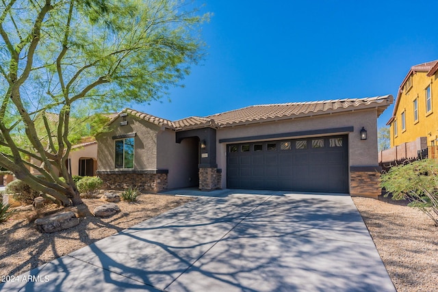 mediterranean / spanish-style home featuring a garage