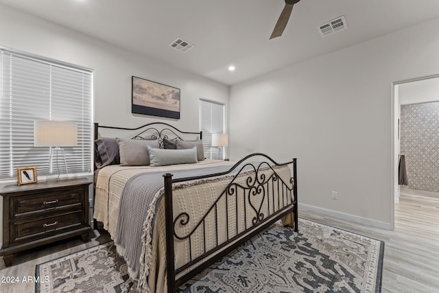 bedroom featuring light wood-type flooring and ceiling fan