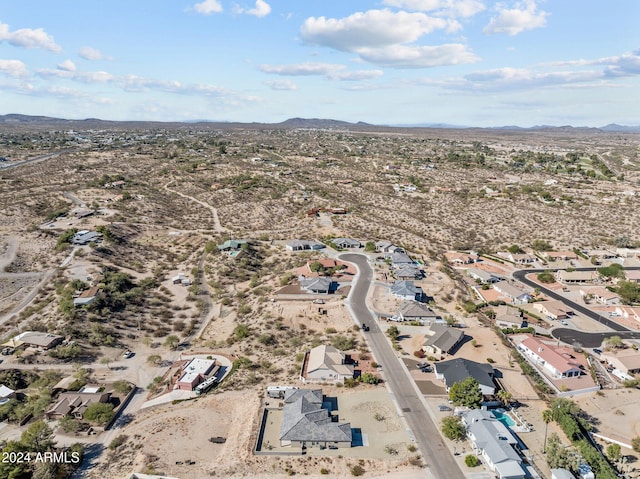 birds eye view of property featuring a mountain view