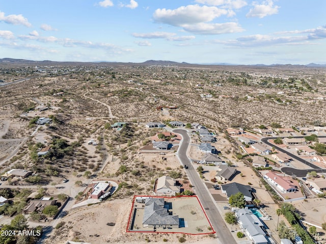 birds eye view of property with a mountain view