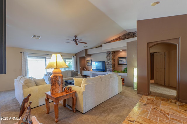 living room featuring lofted ceiling and ceiling fan