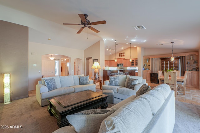 carpeted living room featuring lofted ceiling and ceiling fan