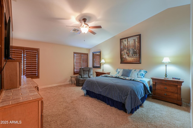 carpeted bedroom featuring ceiling fan and vaulted ceiling