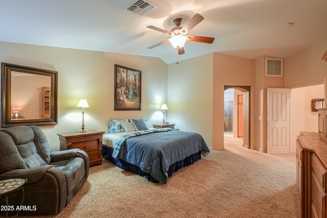 bedroom featuring ceiling fan, light colored carpet, and lofted ceiling