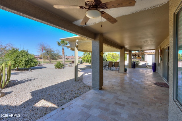 view of patio featuring ceiling fan and a pergola