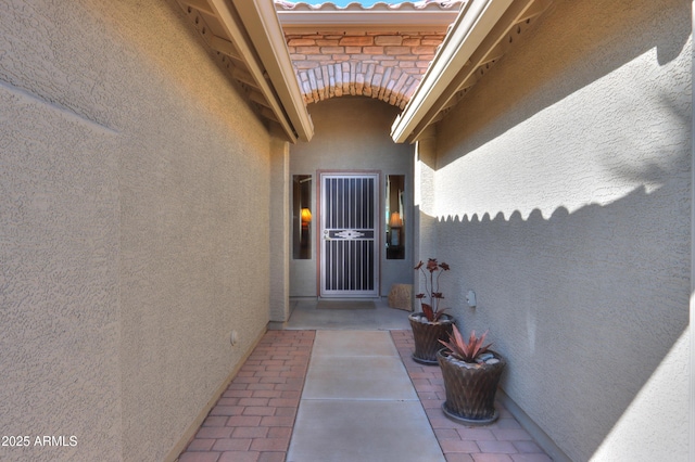 entrance to property featuring a patio area