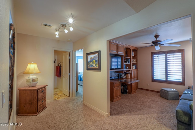 carpeted living room featuring ceiling fan