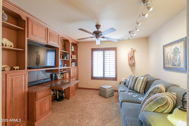 living room with light carpet and ceiling fan