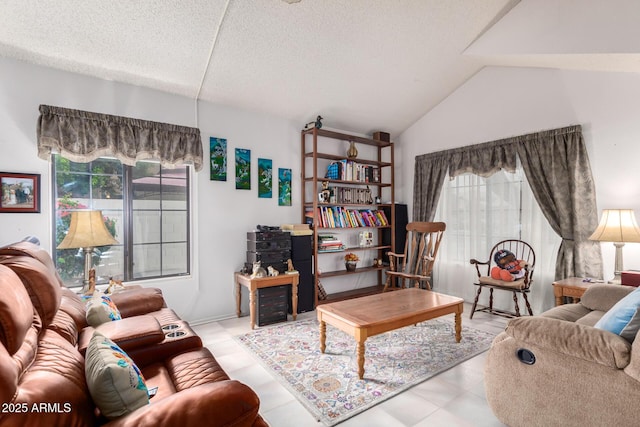 living room with lofted ceiling and a textured ceiling