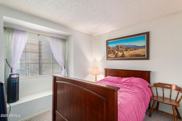 bedroom with carpet and a textured ceiling